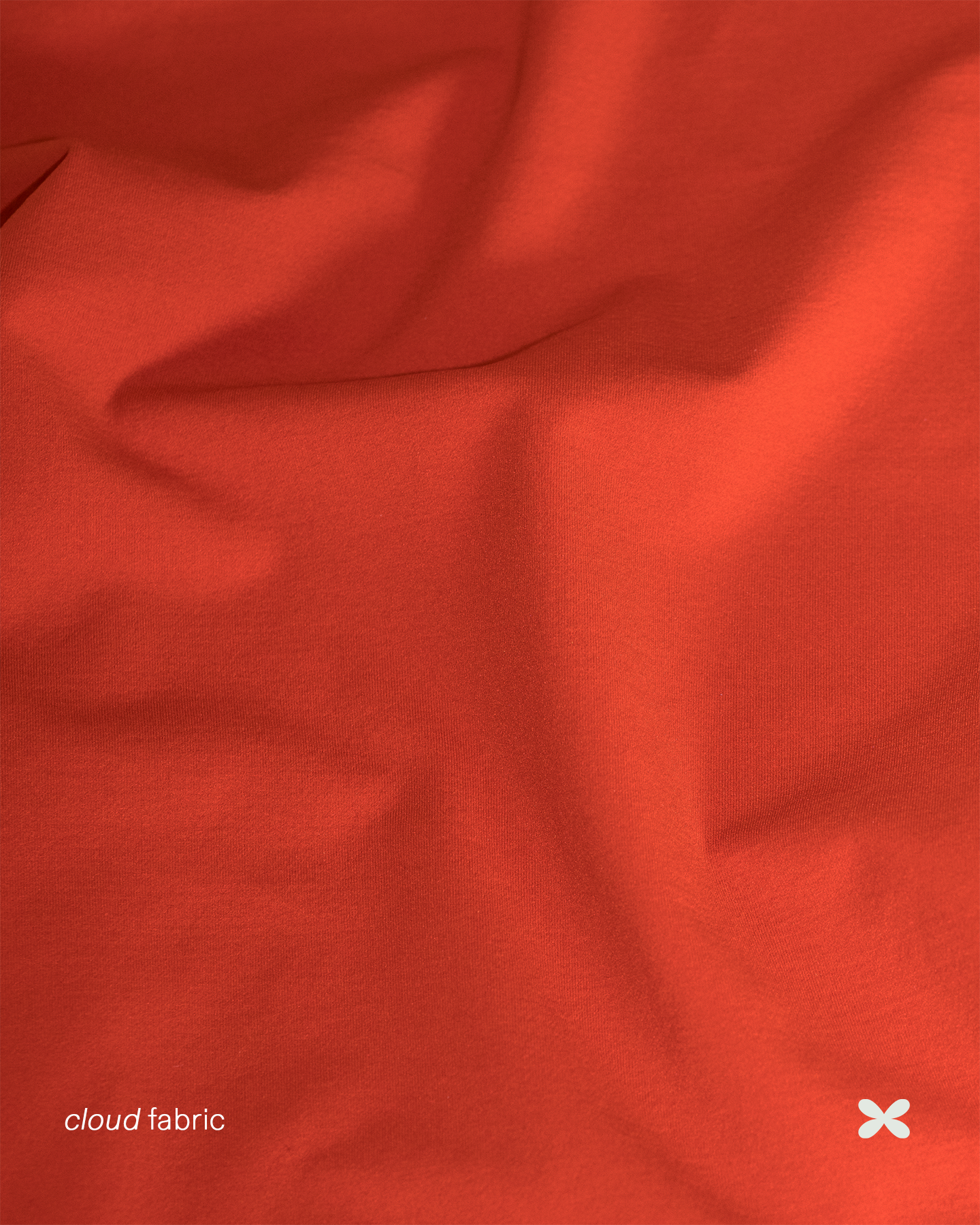 Close-up of orange fabric with 'cloud fabric' branding.