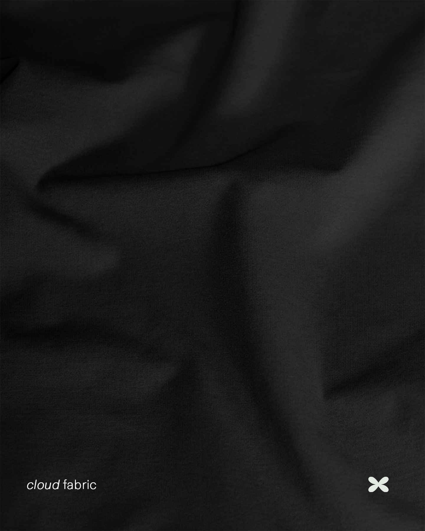 Close-up of black fabric with 'cloud fabric' branding.